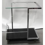 Mid Century Furniture - Follower of Eileen Gray, a chromed, square framed trolley with glass top and