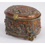 Jewellery Box - A 19th century French oval lidded high relief copper and brass jewellery casket