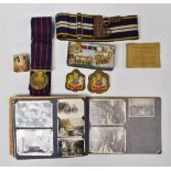 Militaria - A quantity of WWII and later photographs, a Royal Army Ordnance Corps belt, a
