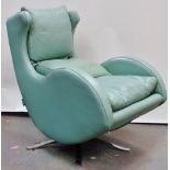 Mid Century Furniture - Fama, a light teal leather Scandinavian design upholstered armchair on