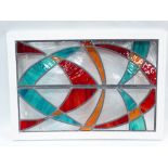 Stained Glass Panel - An abstract design leaded glass panel with red, amber and turquoise glass in a