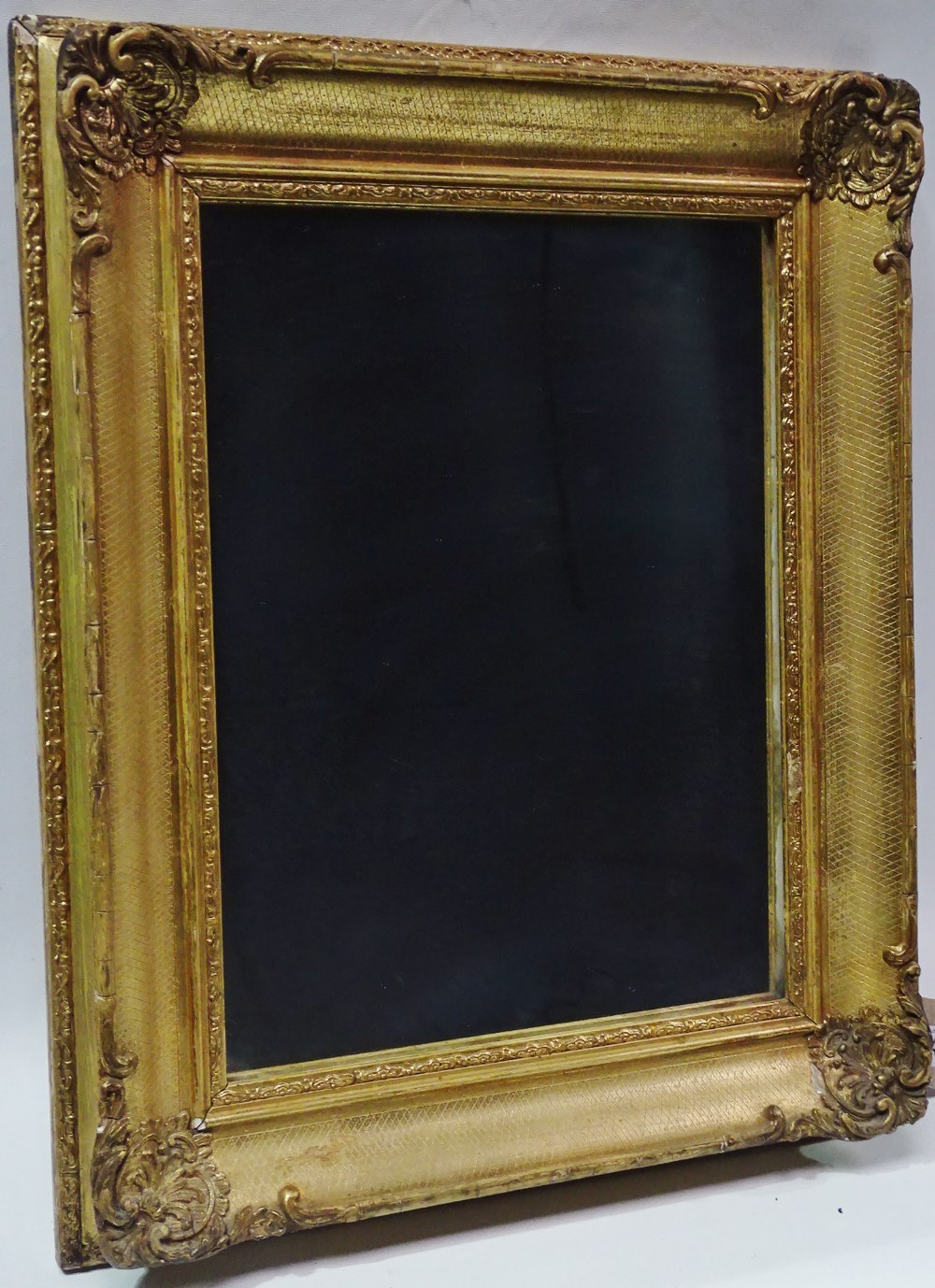 19th Century Wall Mirror - A gilt framed wall mirror with cross hatch decoration to moulding, height