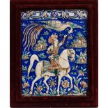 Hawking - A 19th century Persian ceramic plaque depicting a figure on horseback falconing,