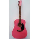 Guitar - A Swift accoustic guitar in pink, together with a Stagg accoustic guitar in blue.