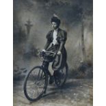 Cycling - A circa 1900 black and white silvered photograph of a lady wearing cycling pantaloons in a