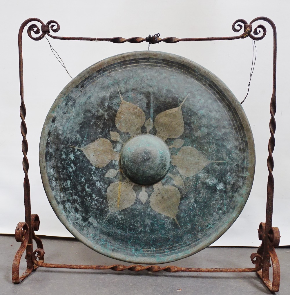 Temple Gong - A large brass gong with dome to middle and lotus leaf decoration, together with beater