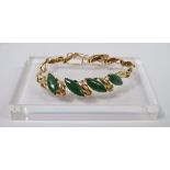 Jade and Gold Bracelet - An eliptical four sectional shaped jade and 14ct gold bracelet, length