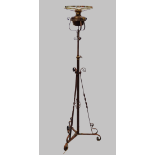Manner of WAS Benson - A telescopic steel, brass and copper standard lamp with copper leaf