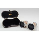 Tiffany & Co. - A pair of mother of pearl covered theatre glasses, cased.