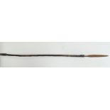Tribal - An African spear with wrought iron blade, coiled ends and wooden shaft, length 140cm.