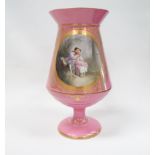 A late 19th century footed vase - A pink vase with flared neck, gilt decorated and with two