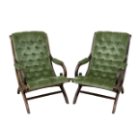 Two reproduction armchairs - A pair of mahogany green upholstered chairs.