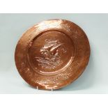 Copper plaque - A circular hand beaten plaque decorated with a galleon to the centre, diameter 39cm.