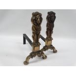 Brass fire dogs - A pair of brass and wrought iron fire dogs modelled as standing lions, height