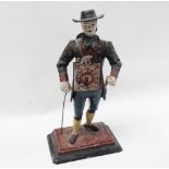 A 19th century Black Forest Clockman - A spelter figure with articulated arms on a rectangular