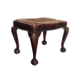 19th century stool - A stool of serpentine shape on short cabriole ball and claw legs with shell