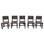 Set of six dining chairs - Six oak chairs with heavily carved backs and overstuffed leather seats.