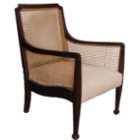 Bergere chair - A mahogany framed chair on square tapering legs and with an upholstered seat.