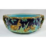 George Jones majolica - A cobalt ground game tureen decorated with a frieze of rabbits, ferns,