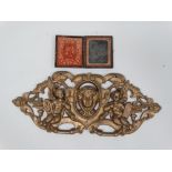 Cast iron plaque etc. - A cast iron plaque decorated with cherubs and a female mask, height 17cm,