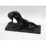 Spelter classical figure - A black spelter figure of a warrior sitting on his shield, a sword to