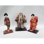 Japanese dolls - Three Japanese dolls, largest height 33cm.