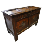 18th century oak coffer - An oak coffer, the two panelled front with carved decoration below a