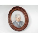 Victorian miniature - An oval miniature of a gentleman in a wooden frame, overall size 10 x 8cm.