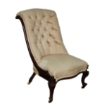 Victorian nursing chair - A walnut framed chair on short carved cabriole legs with castors.