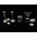 Silver - A pair of filled silver candlesticks, Birmingham 1919, height 13.5cm, together with a