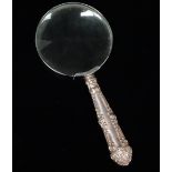 Silver - A small magnifying glass with silver filled handle, Sheffield 1912, length 14.3cm.