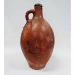 Bellarmine style jug - A brown glazed stoneware vessel with single loop handle to the neck, height