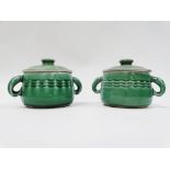 Denby - A pair of twin handled green glazed pots and covers, the handles modelled as salmon,