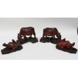 Chinese hardwood buffalo - Four hardwood buffalo on carved wooden stands, largest height 12.5cm,