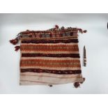 Camel bag and knife - A hand knotted camel bag decorated with tassels and shells, 110 x 60cm,