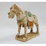 Tang style horse - A terracotta horse with glazed saddle and saddle rug, height 23cm.