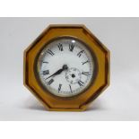 An early 20th century amber glass clock - of octagonal form, the white dial set out in Roman