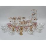 A mid 20th century lemonade jug and six glasses - gilt decorated and etched berries and foliage,