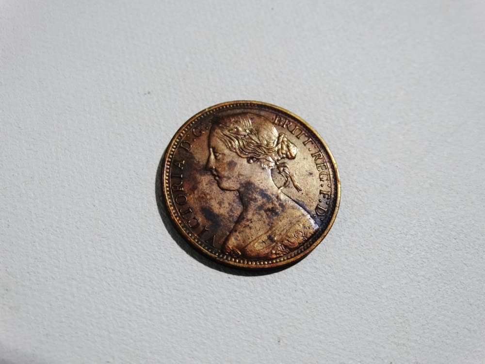 Coins - a Victoria one penny 1864.