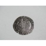 Coins - a Charles I six pence piece.