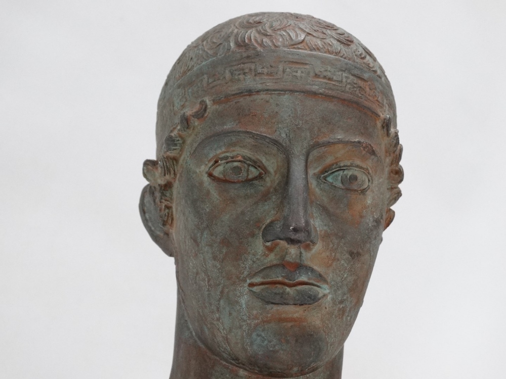 Bust of a charioteer - modelled in terracotta with a Verdigris finish, raised on a beech plinth, - Image 2 of 4