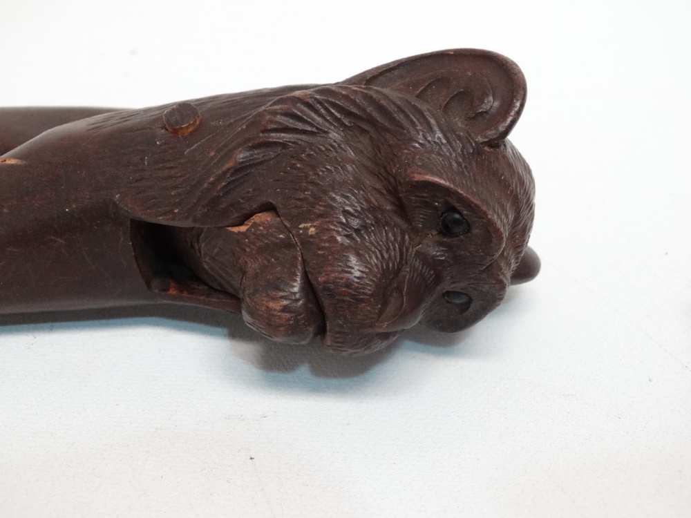 A pair of early 20th century Black Forest nut crackers - modelled as a monkey, together with a - Image 5 of 7