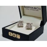 A pair of diamond earrings - pave set within a square 18ct white gold frame, weight 3.5g.