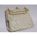 A mid 20th century evening bag - white sequins on a gilt metal frame, width 15cm