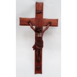 An early 20th century oak crucifix - height 67cm.