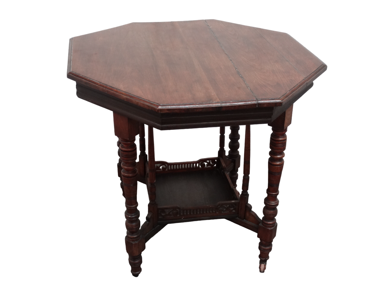 An Edwardian walnut occasional table - the octagonal top on square and turned legs joined by an