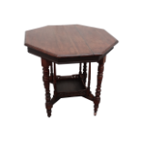 An Edwardian walnut occasional table - the octagonal top on square and turned legs joined by an