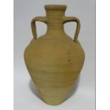 A terracotta twin handled urn - of tapered form, height 53cm.