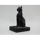 A 20th century cast Egyptian cat - seated and mounted on a plinth base, height 12cm.