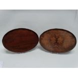 A George III style rosewood oval tray - with a waved gallery, 30 x 45cm, together with another